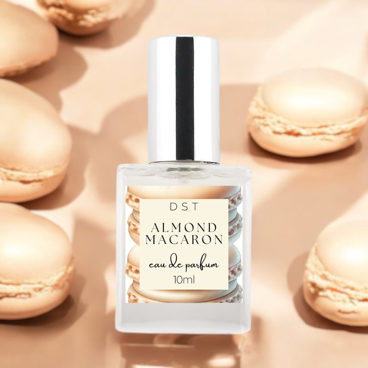 10ml bottle of Almond Macaron Eau de Parfum against a tan background with almond french macarons.