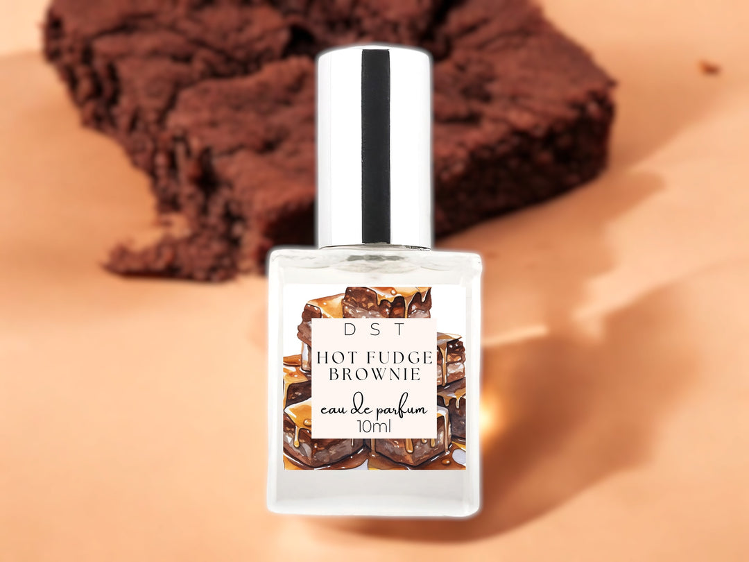 10ml bottle of hot fudge brownie eau de parfum on light brown background with brown brownie