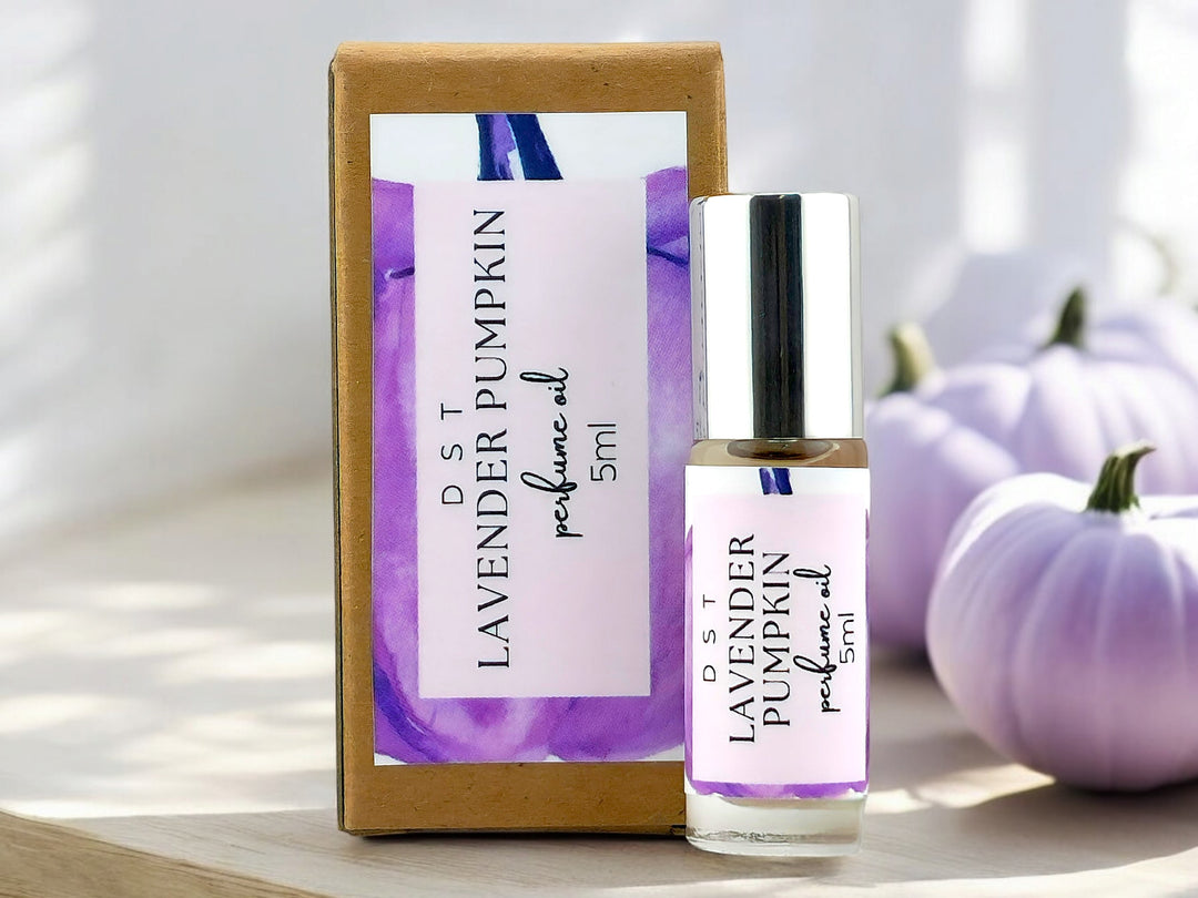 5ml bottle of lavender pumpkin perfume oil with box it is packaged in on white background with purple pumpkins