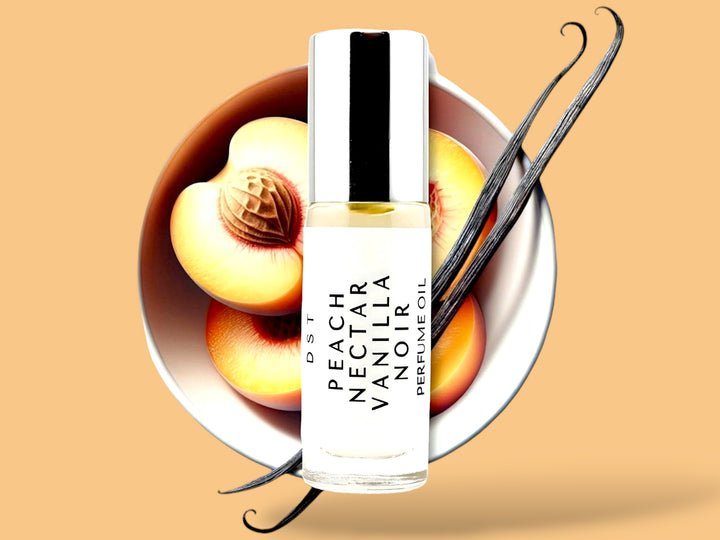 5 milliliter bottle of Peach nectar and vanilla noir perfume oil sitting in front of a large white bowl filled with Peach halves and long vanilla beans against a Peach colored background.