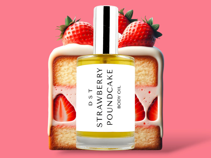 100ML bottle of Strawberry Poundcake body oil sitting in front of a large slice of Strawberry Poundcake topped with strawberries against a bright pink background. 