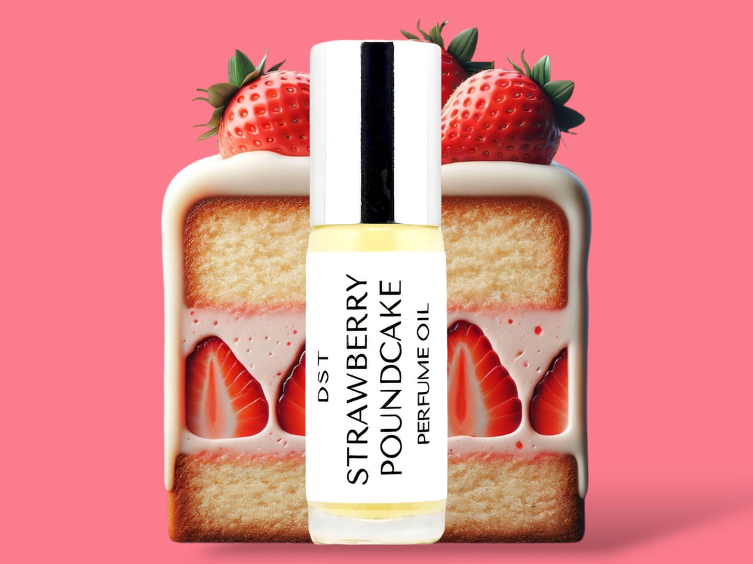 5ML bottle of Strawberry Poundcake perfume oil sitting in front of a large slice of Strawberry Poundcake topped with strawberries against a bright pink background. 