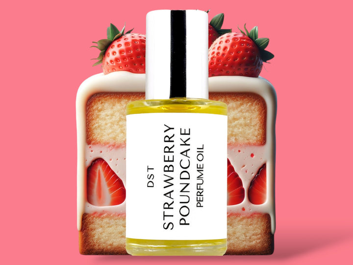 30ML bottle of Strawberry Poundcake perfume oil sitting in front of a large slice of Strawberry Poundcake topped with strawberries against a bright pink background. 