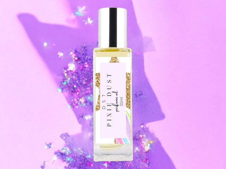 30ml bottle of Pixie Dust perfume oil with pastel purple glittery background.