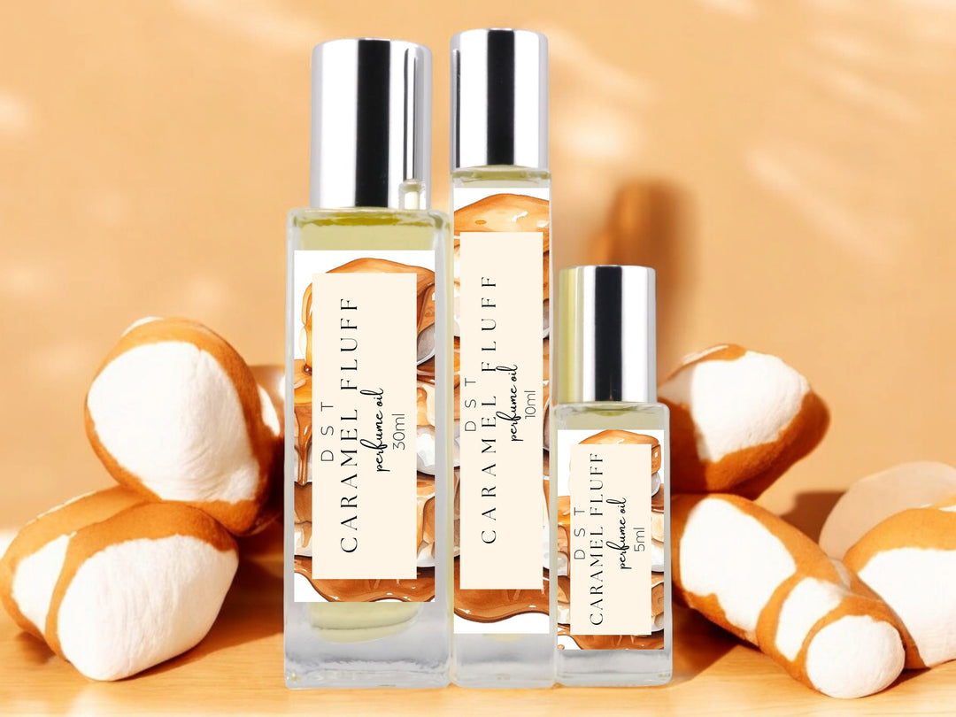 5ml, 10ml, 30ml bottles of caramel fluff perfume oil on tan background with white marshmallows covered in caramel