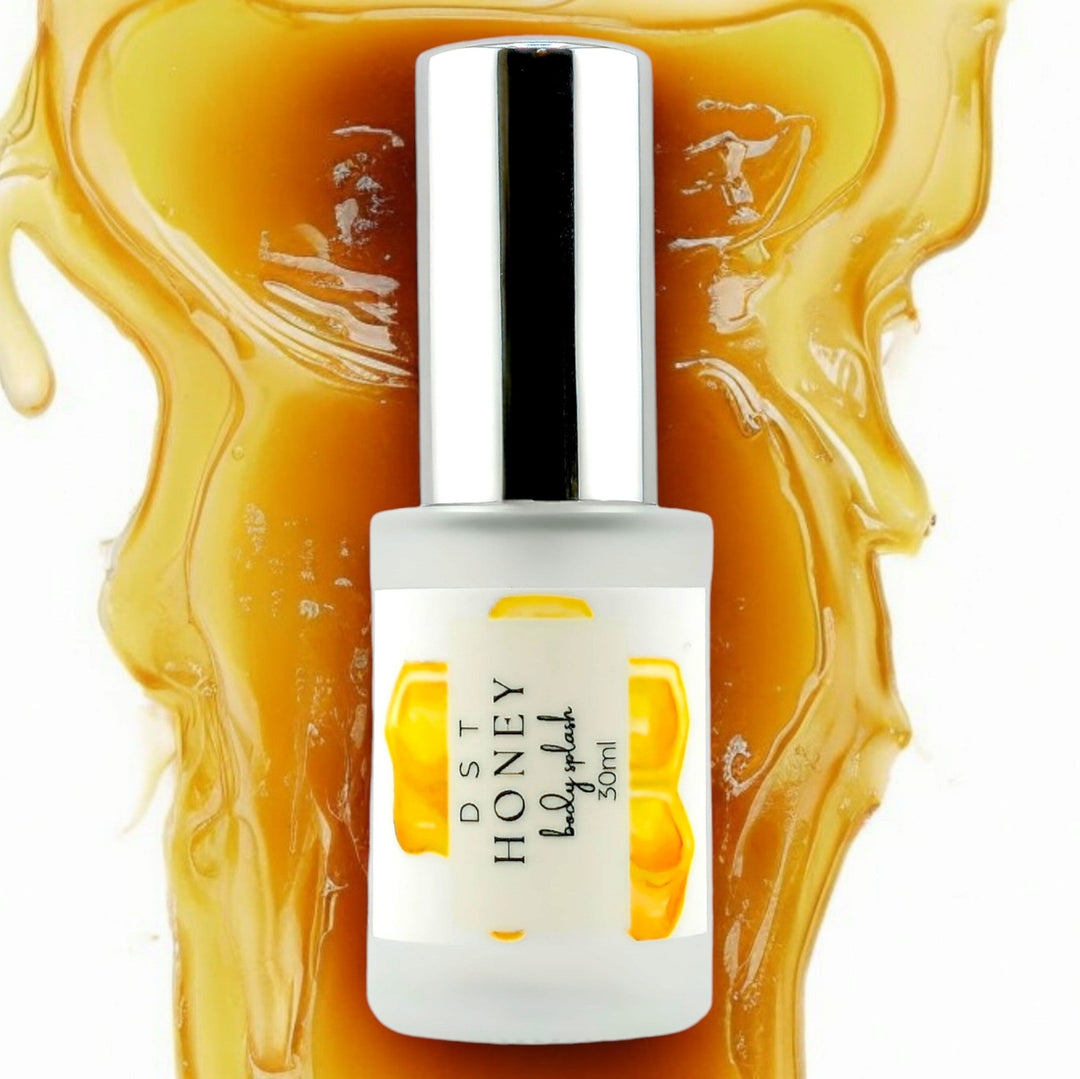 30ml bottle of Honey body splash with white background and Honey flowing down from the top of the image behind the bottle.