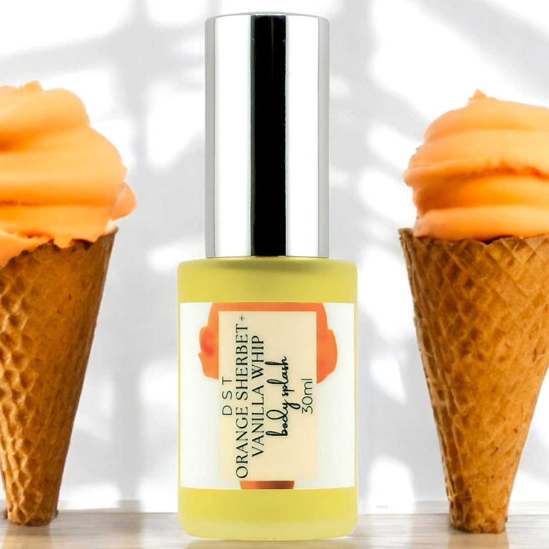 30ml bottle of Orange Sherbet and Vanilla Whip against white background and 2 Waffle Cones filled with orange sherbet. 