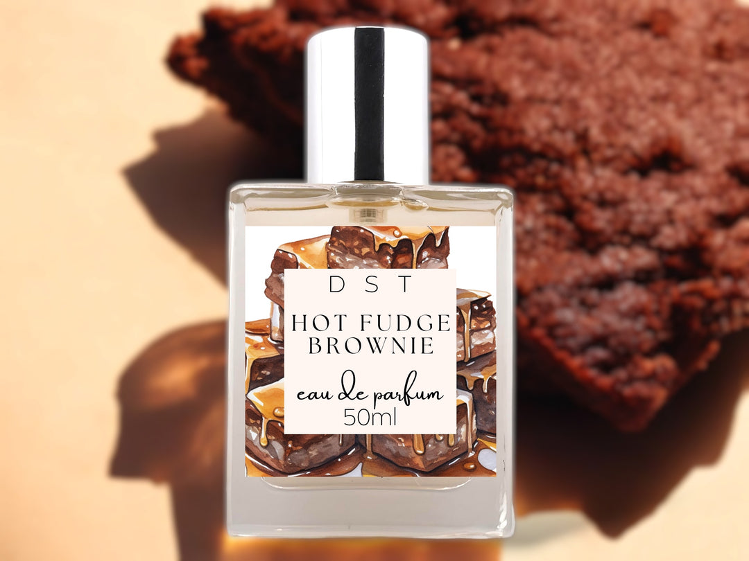 50ml bottle of hot fudge brownie eau de parfum on light brown background with brown brownie