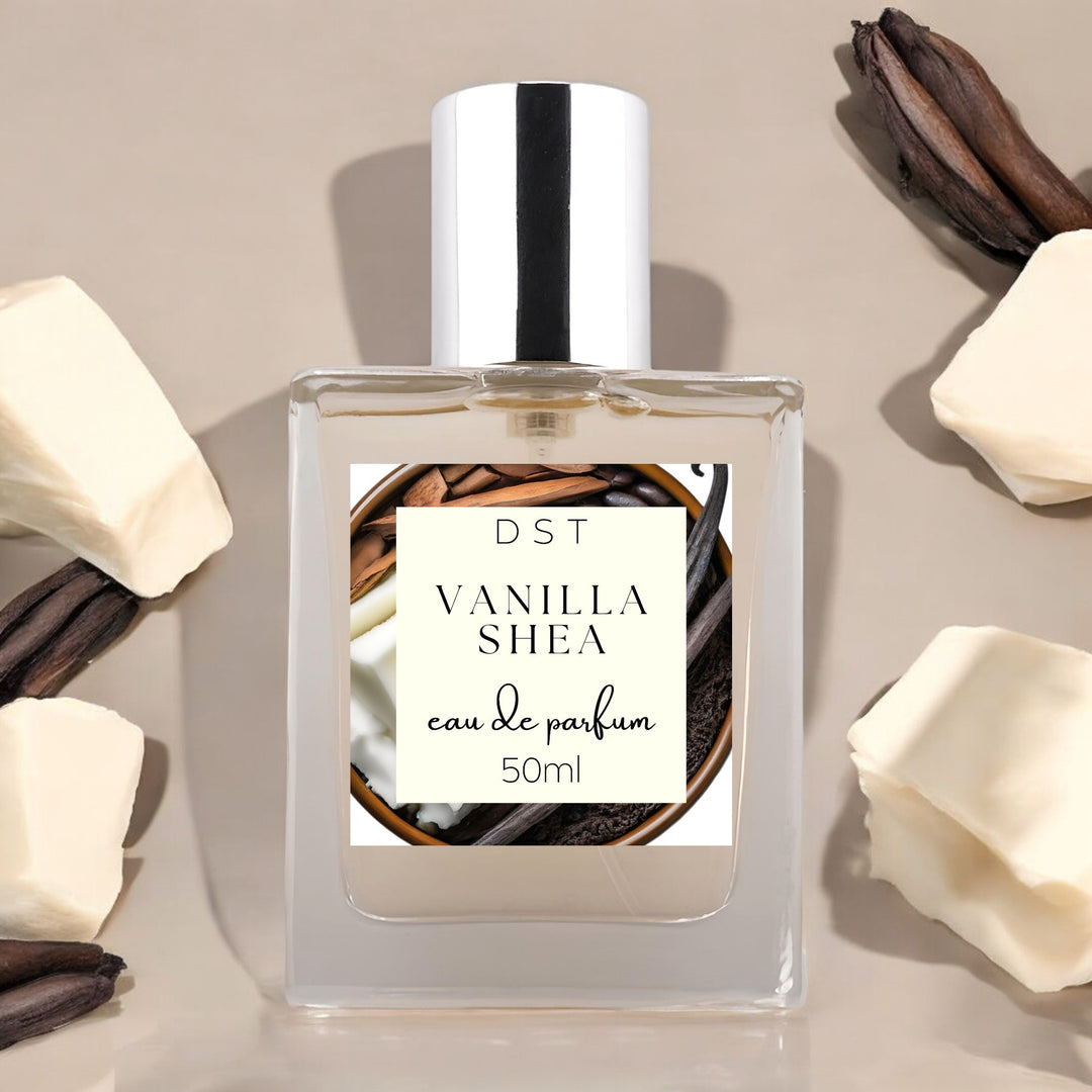 50ml bottle of Vanilla Shea Eau de Parfum against a tan background with chunks of shea butter and long vanilla beans.