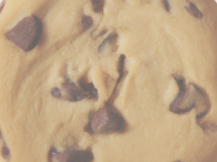 Muted Video showing text fragrance description for Chocolate Chip Cookie. Rich, velvety chocolate meld with  the comforting scent of buttery dough creating an aroma that's both nostalgic and irresistible.  

